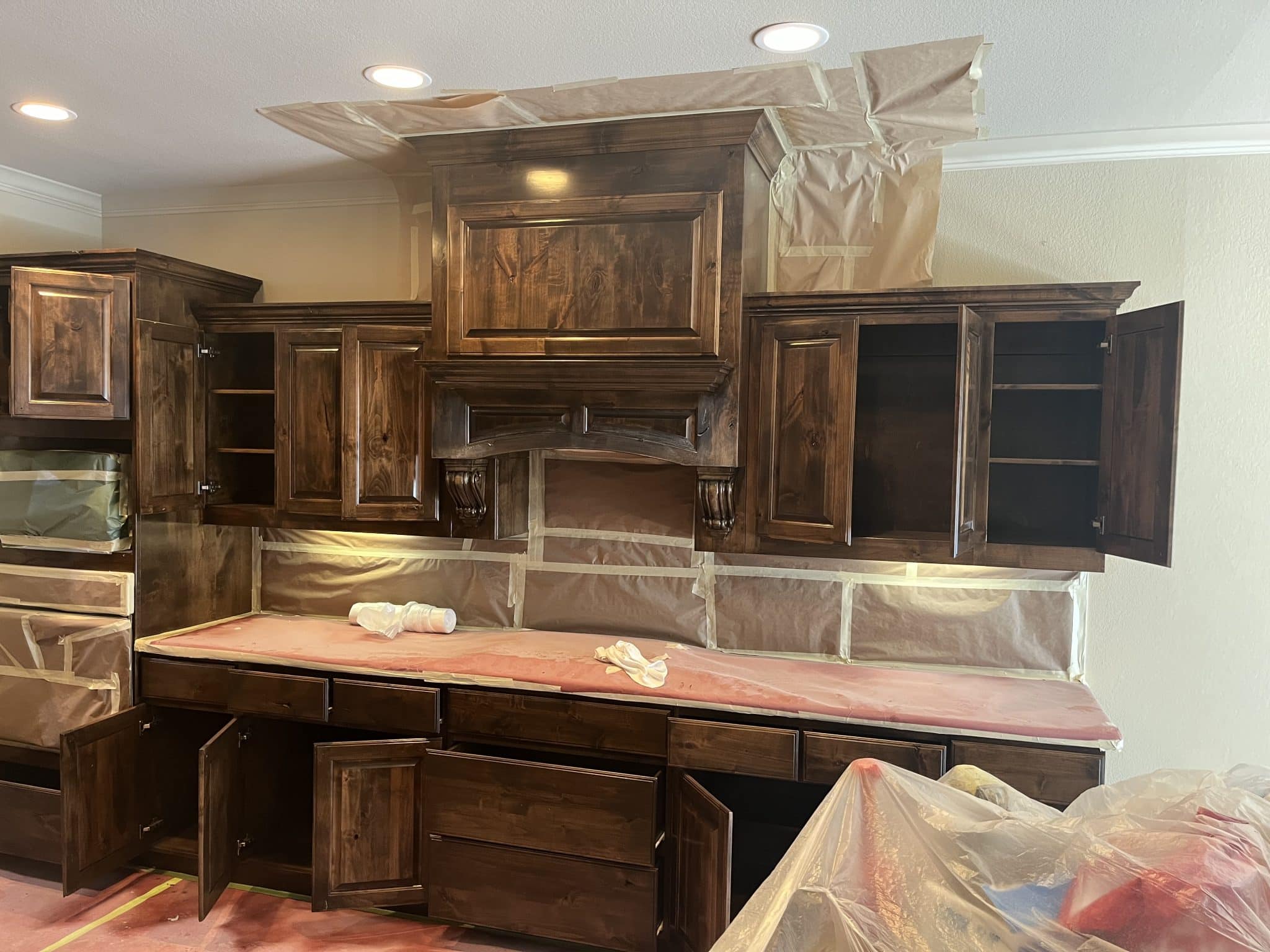 Kitchen cabinets being restained